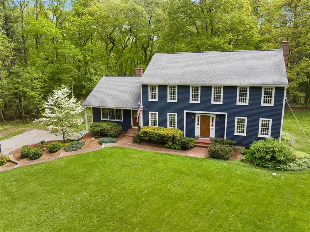 94 Middleton Road Boxford, MA 01921 - Photo 1 of 36 a aerial view of a brick house next to a yard with big trees