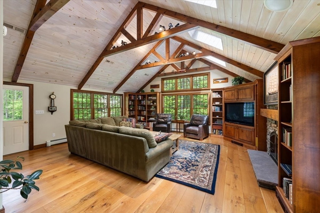 94 Middleton Road Boxford, MA 01921 - Photo 15 of 36 a living room with furniture and a flat screen tv