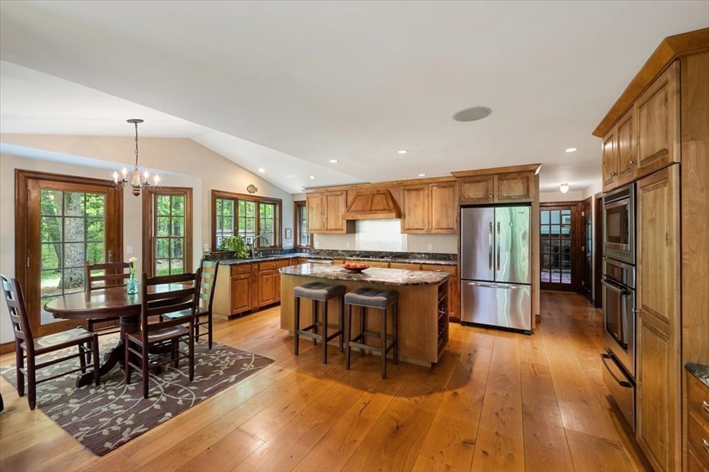 94 Middleton Road Boxford, MA 01921 - Photo 16 of 36 a room with lots of wooden furniture dining table and wooden floor