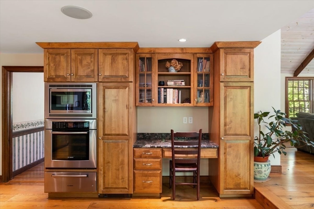 94 Middleton Road Boxford, MA 01921 - Photo 20 of 36 a kitchen with stainless steel appliances granite countertop a refrigerator and a stove top oven
