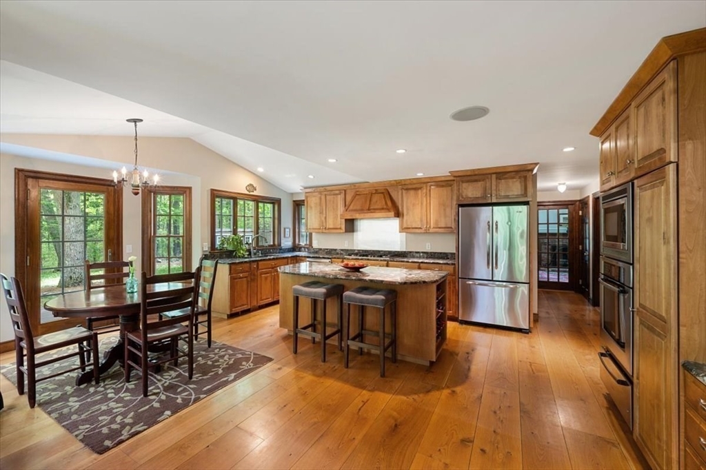 94 Middleton Road Boxford, MA 01921 - Photo 21 of 36 a room with lots of wooden furniture dining table and wooden floor