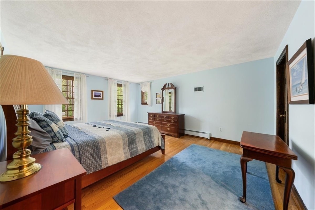 94 Middleton Road Boxford, MA 01921 - Photo 27 of 36 a bed room with a bed and a chair