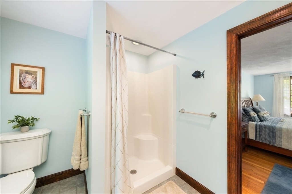 94 Middleton Road Boxford, MA 01921 - Photo 32 of 36 a bathroom with a shower and a toilet