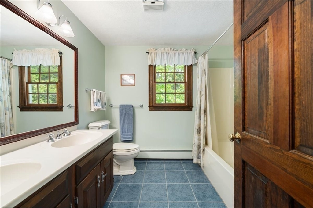 94 Middleton Road Boxford, MA 01921 - Photo 33 of 36 a bathroom with a sink a toilet and shower