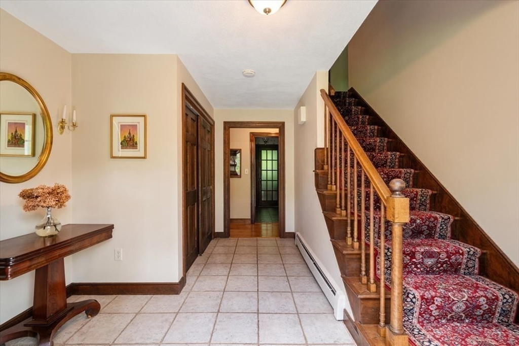 94 Middleton Road Boxford, MA 01921 - Photo 35 of 36 a view of a hallway with wooden floor and staircase