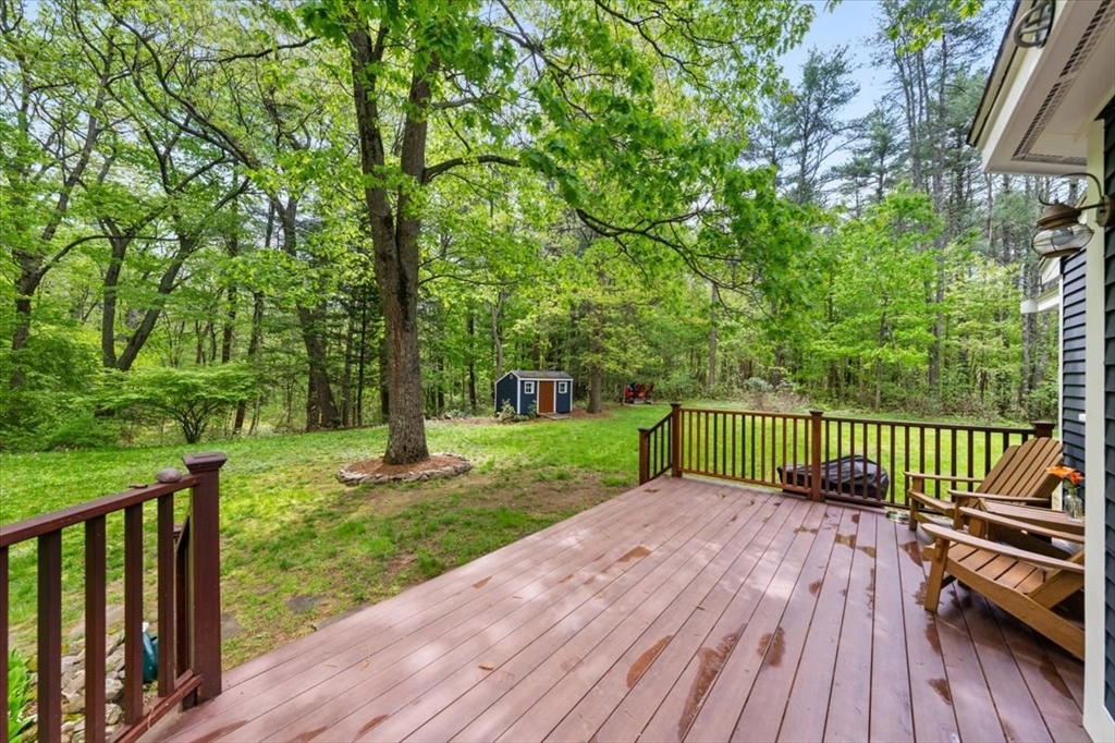 94 Middleton Road Boxford, MA 01921 - Photo 9 of 36 a view of a deck with a wooden floor and fence