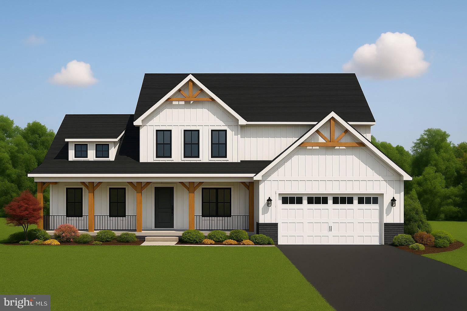 a front view of a house with a garden and yard