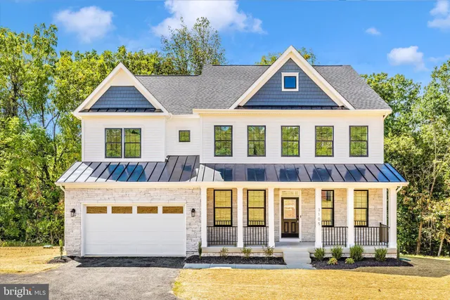 a front view of residential houses with yard