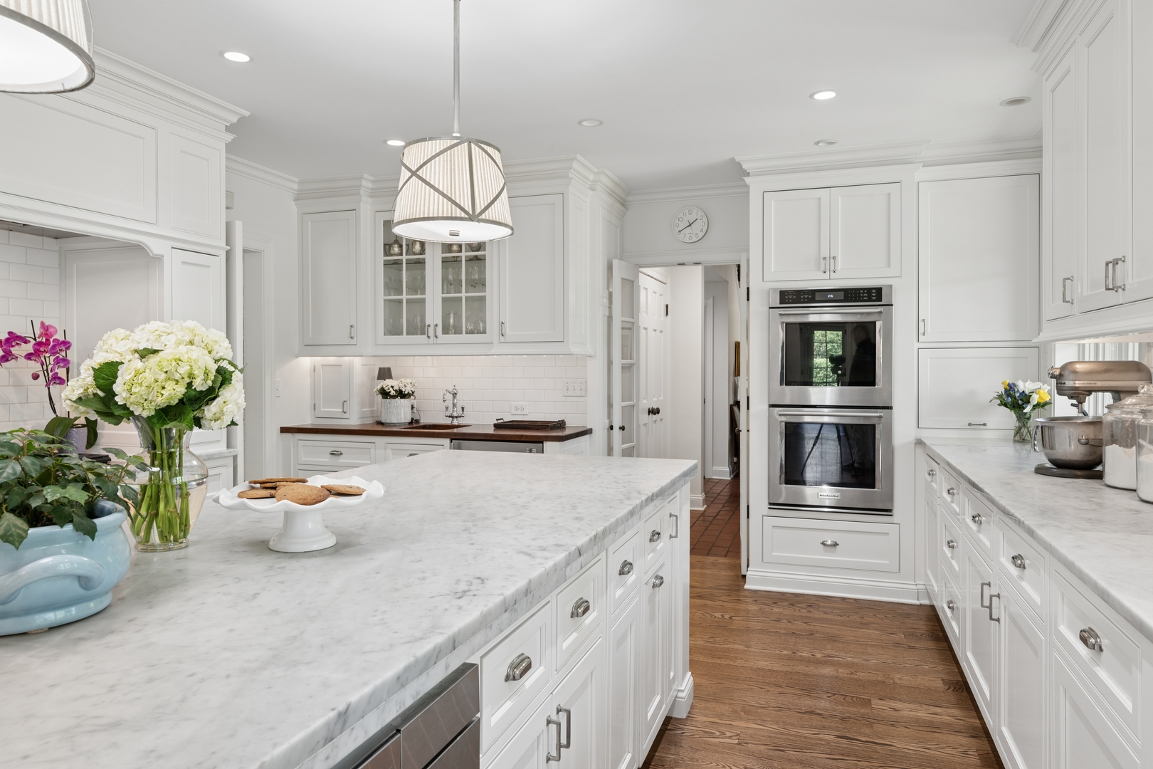 936 Sunset Road Winnetka, IL 60093 - Photo 19 of 50 a kitchen with stainless steel appliances granite countertop a sink dishwasher a refrigerator and a stove