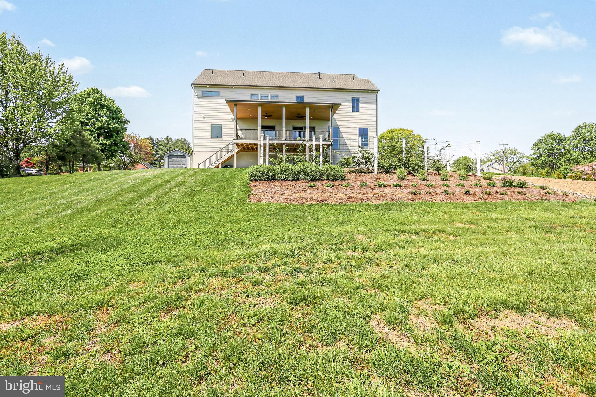 1 Strawberry Lane Lititz, PA 17543 - Photo 20 of 102 a view of a house with a yard and sitting area