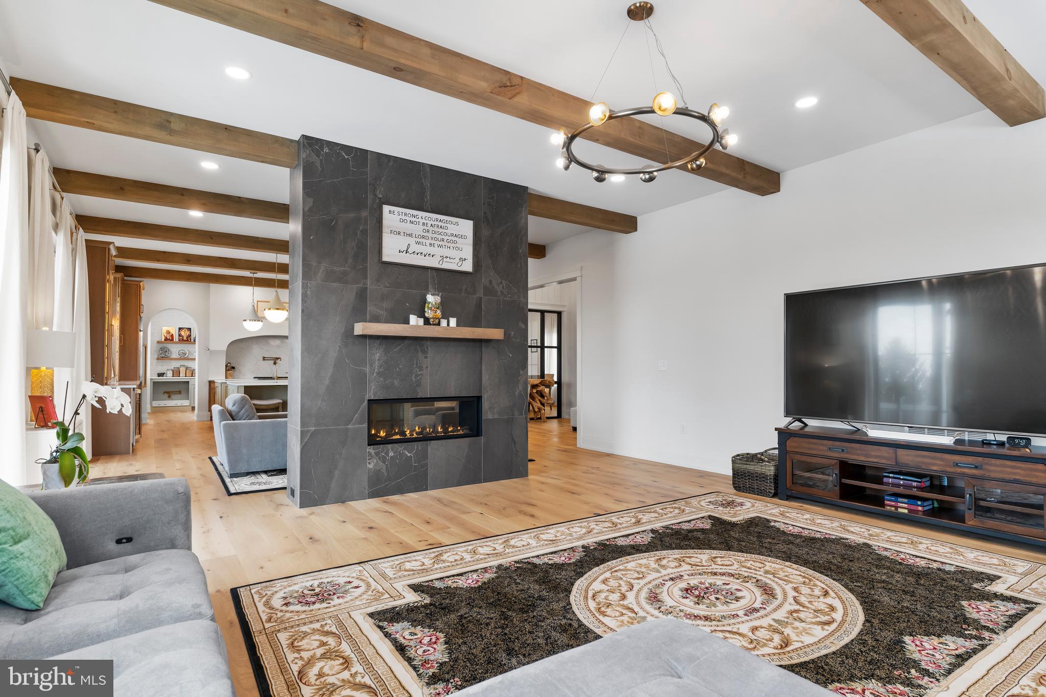 1 Strawberry Lane Lititz, PA 17543 - Photo 41 of 80 a living room with fireplace furniture and a flat screen tv