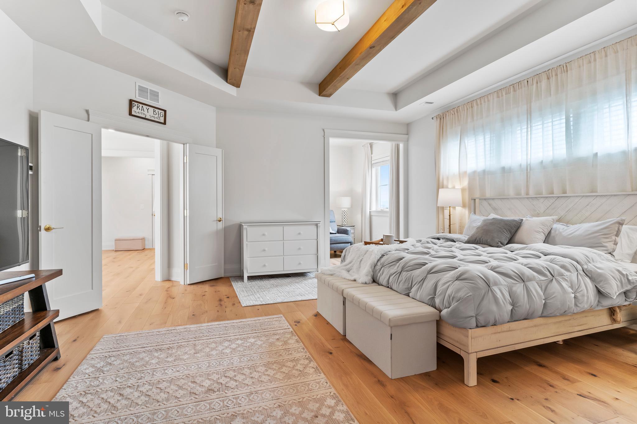 1 Strawberry Lane Lititz, PA 17543 - Photo 57 of 80 a spacious bedroom with a bed and a couch