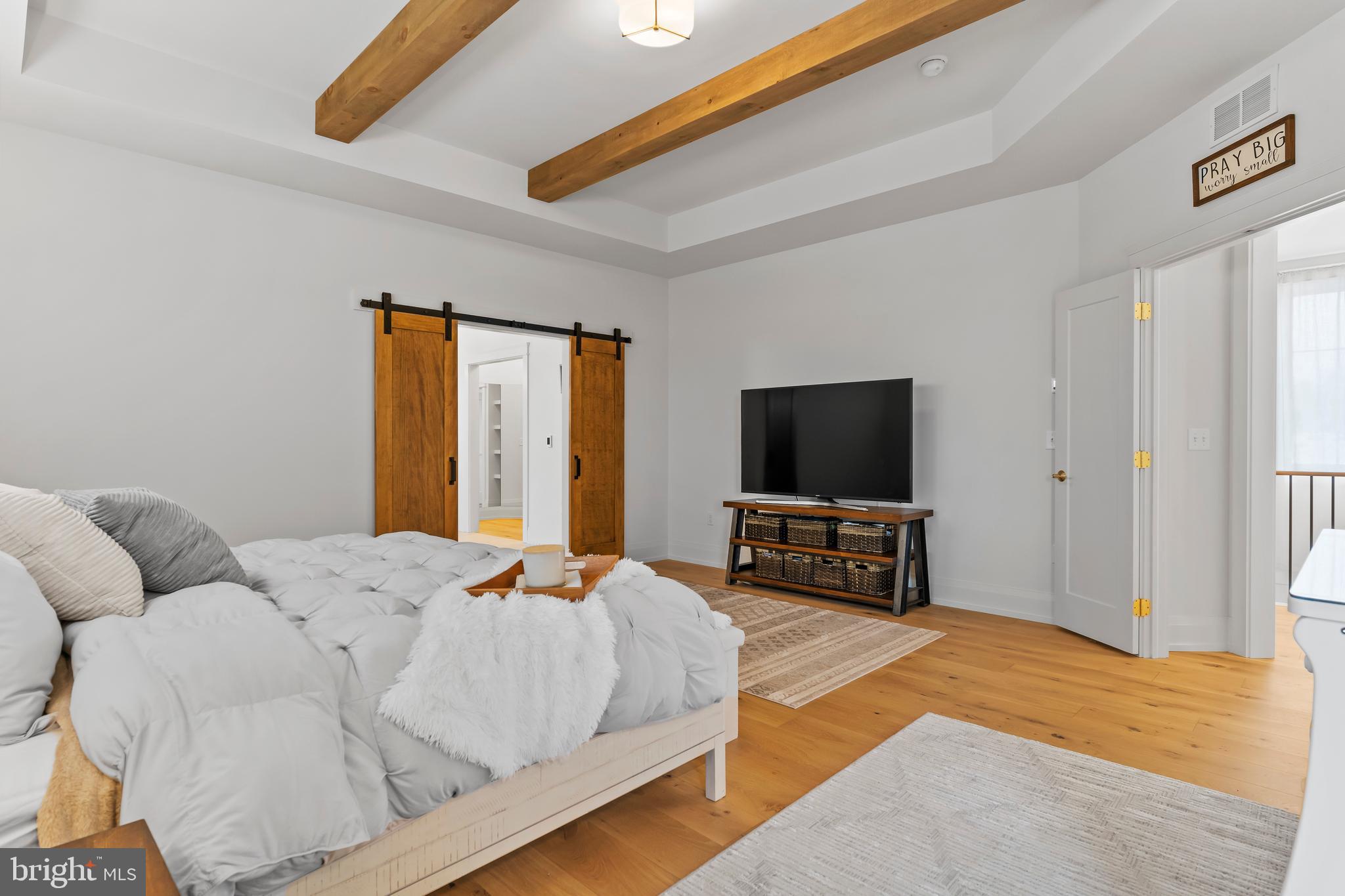 1 Strawberry Lane Lititz, PA 17543 - Photo 59 of 80 a bedroom with a bed and a flat screen television