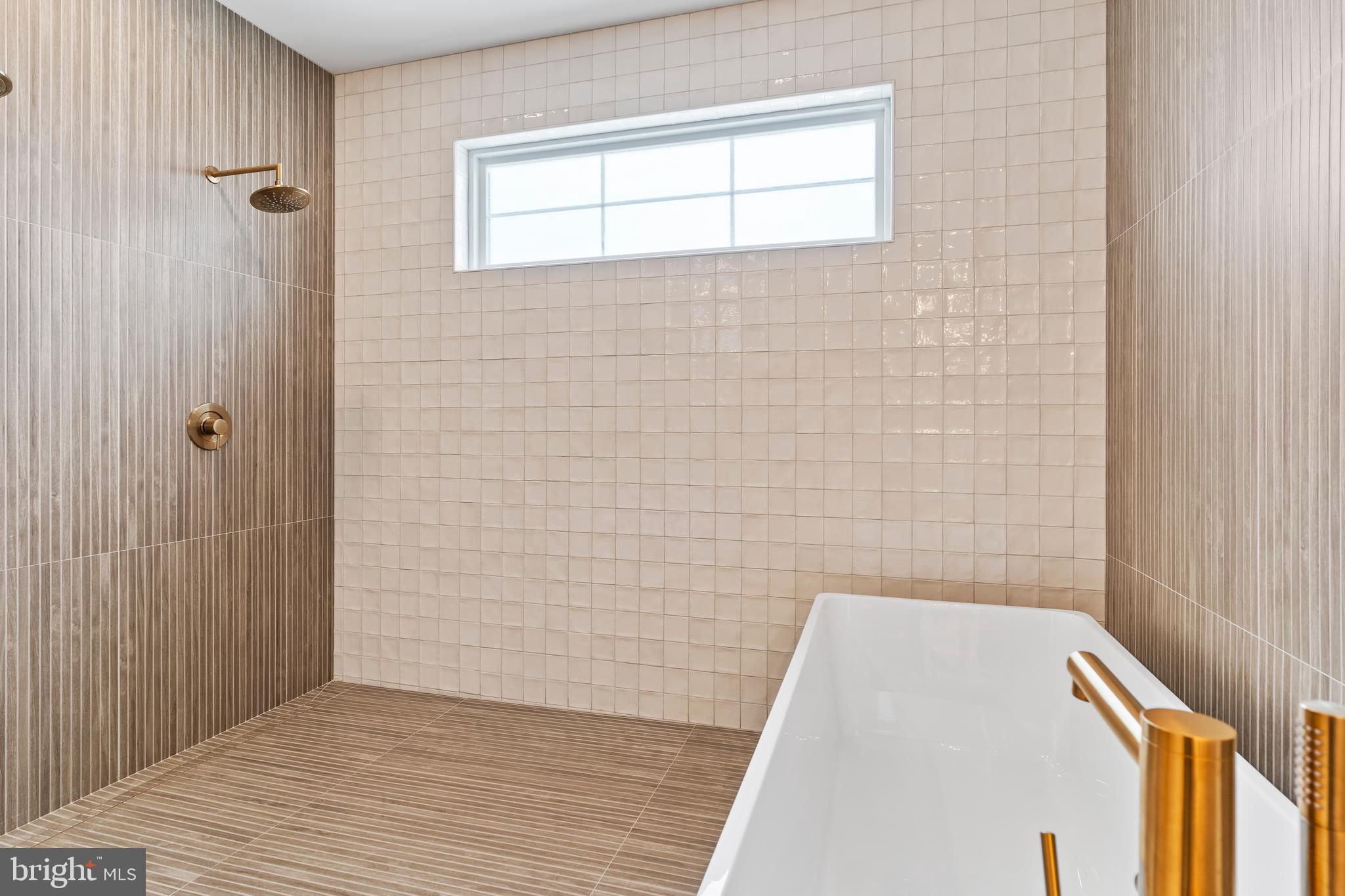 1 Strawberry Lane Lititz, PA 17543 - Photo 63 of 80 a bathroom with a bathtub and shower