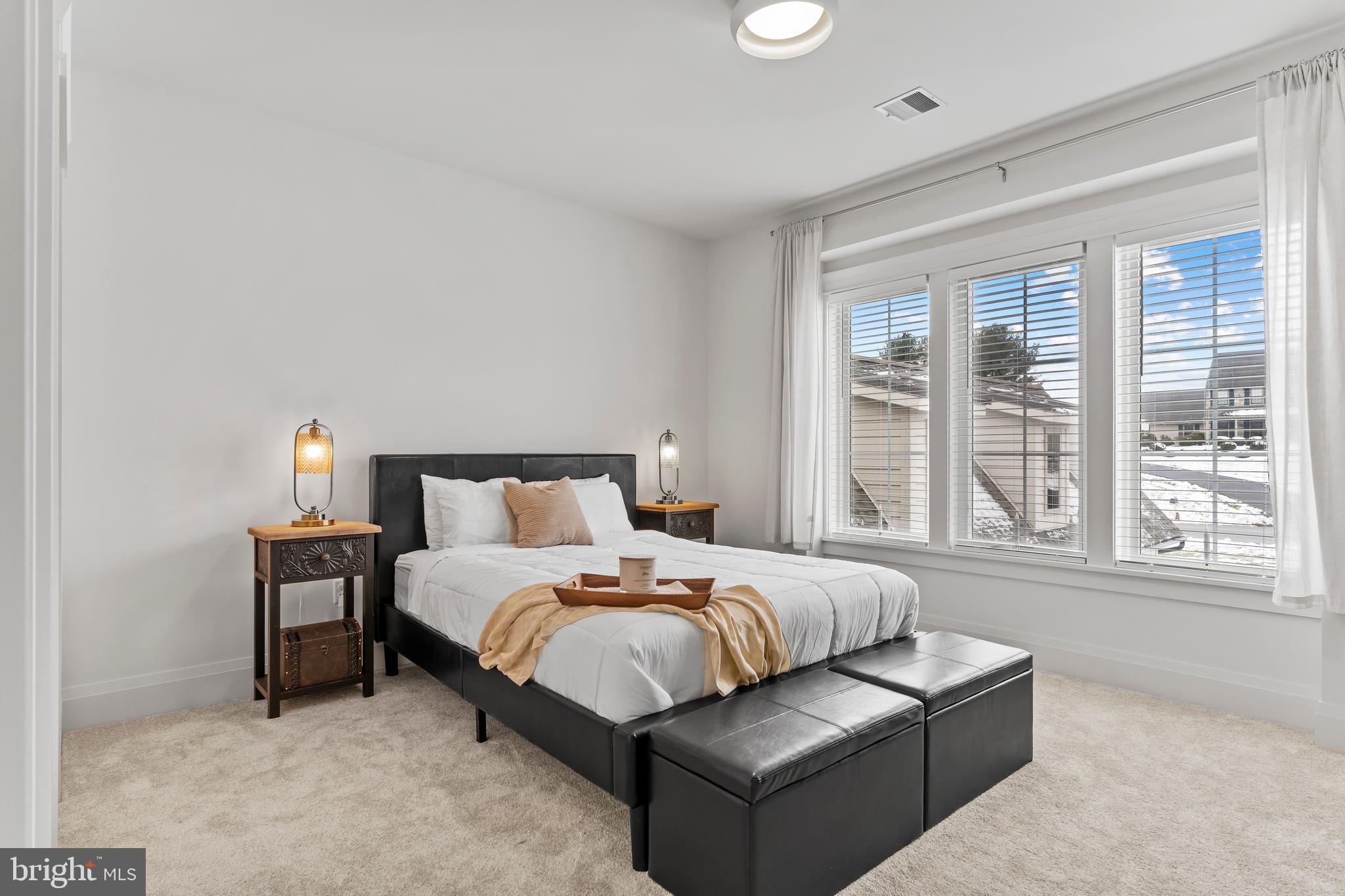 1 Strawberry Lane Lititz, PA 17543 - Photo 67 of 80 a bedroom with a bed couch and a large window