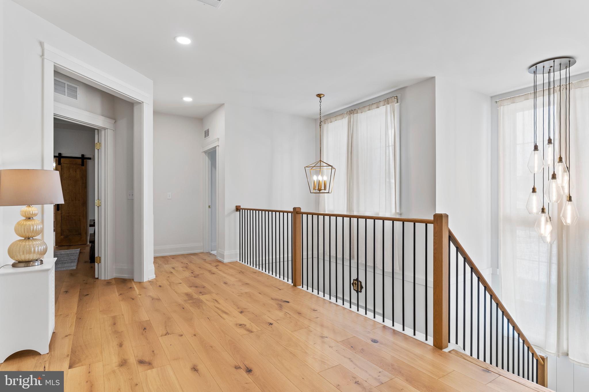 1 Strawberry Lane Lititz, PA 17543 - Photo 85 of 102 a view of a hallway view with wooden floor and staircase