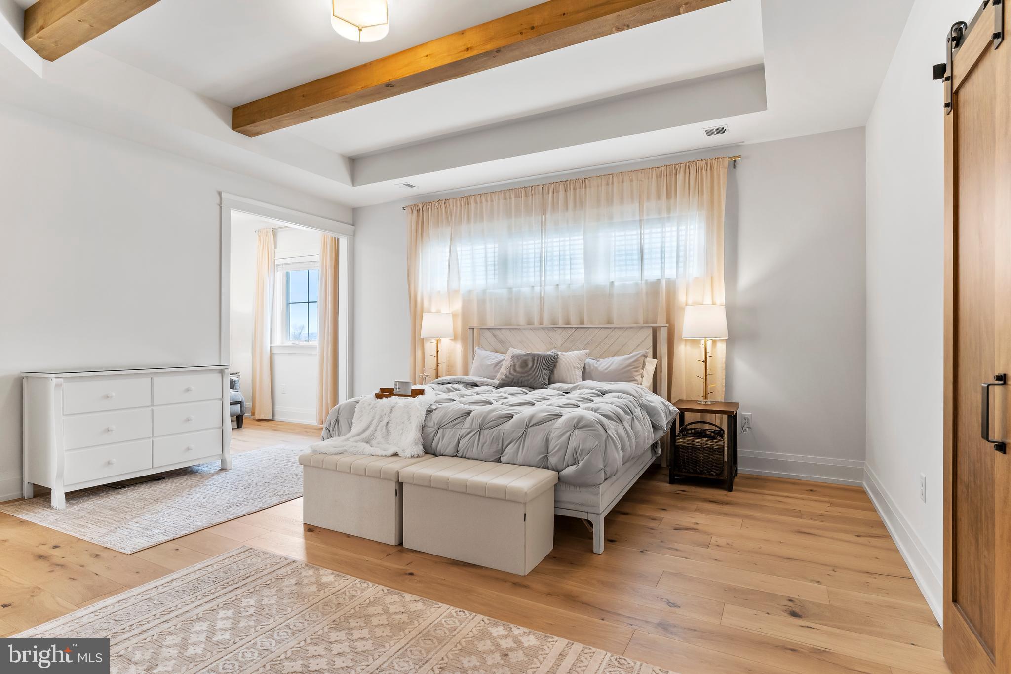 1 Strawberry Lane Lititz, PA 17543 - Photo 87 of 102 a spacious bedroom with a bed and a dresser