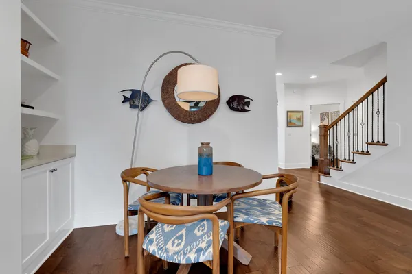 a view of a dining room with furniture and a mirror