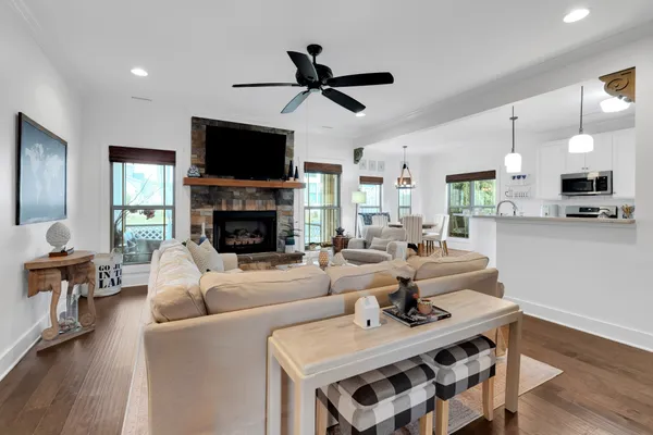 a bedroom with a bed and a ceiling fan
