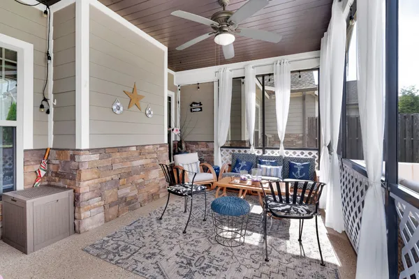 a front view of a house with a yard table and chairs