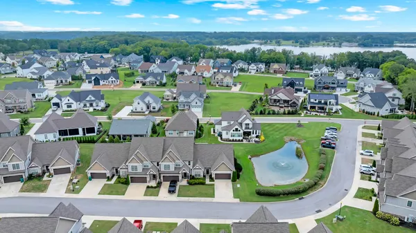 an aerial view of a house with yard swimming pool and outdoor seating