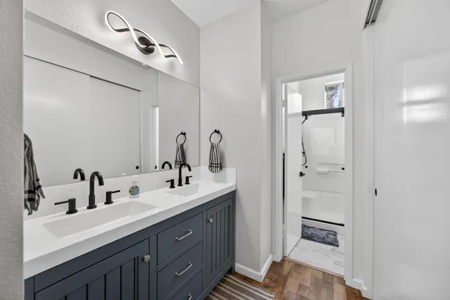 a bathroom with a sink and a mirror