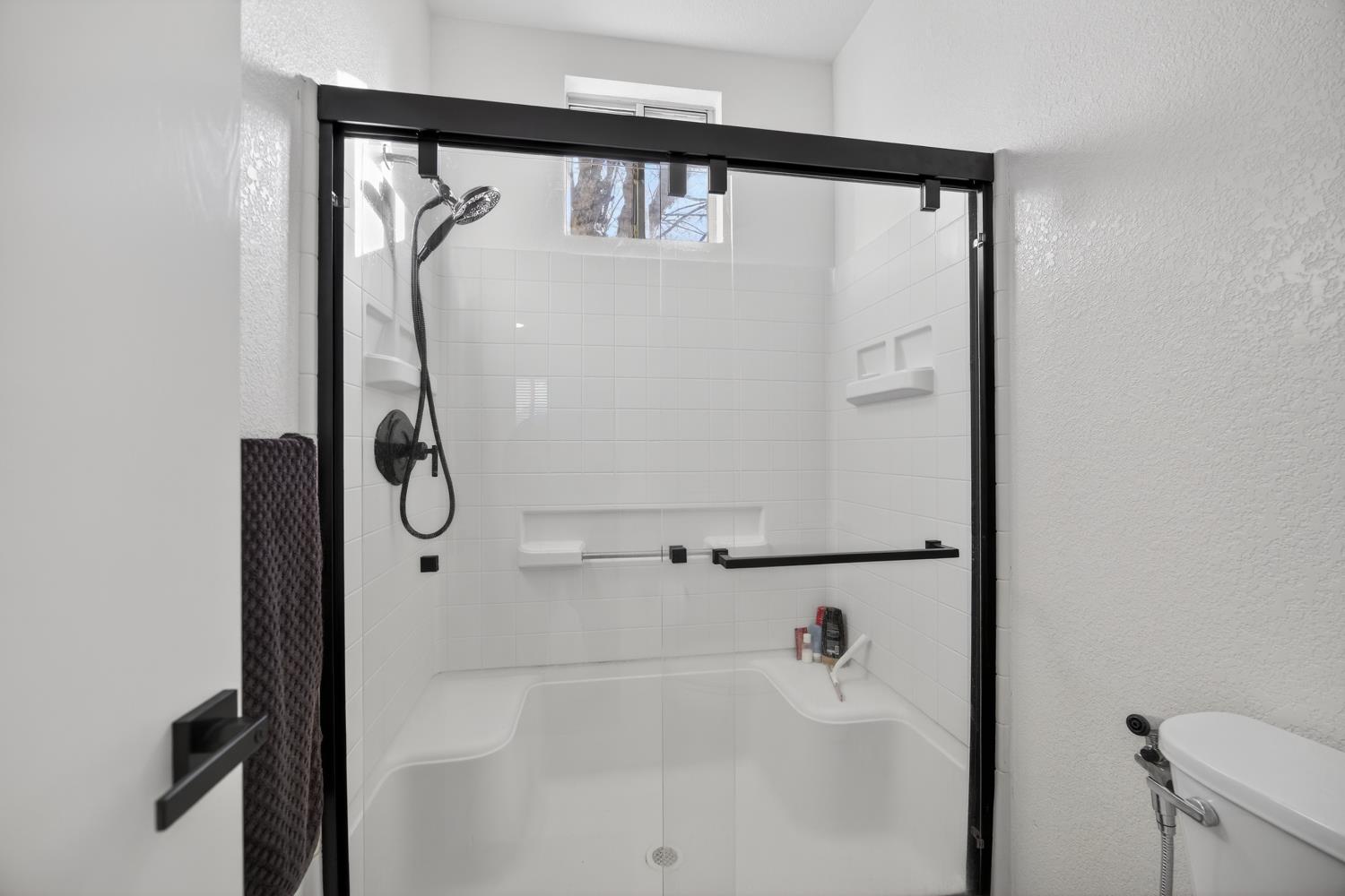9365 Laguna Pointe Way Elk Grove, CA 95758 - Photo 19 of 24 a bathroom with a shower and a tub