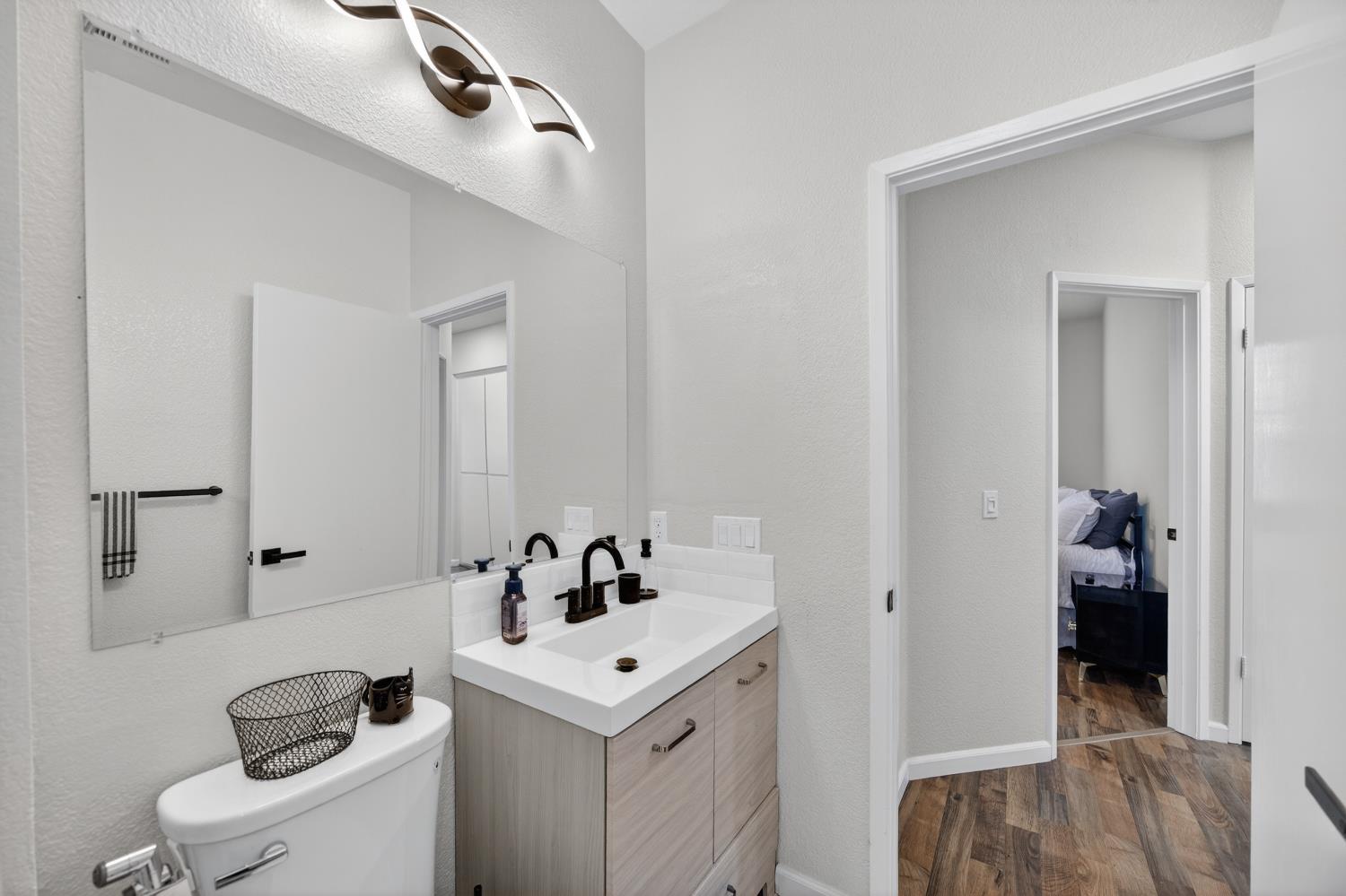 9365 Laguna Pointe Way Elk Grove, CA 95758 - Photo 21 of 24 a bathroom with a sink and a mirror