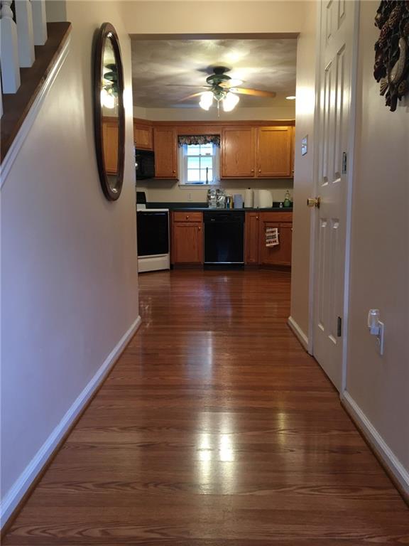 2904 Brodhead Road Aliquippa, PA 15001 - Photo 3 of 20 ENTRY 12x5 Easy to clean laminate leads from the front door to the kitchen. Powder room door to the right.
