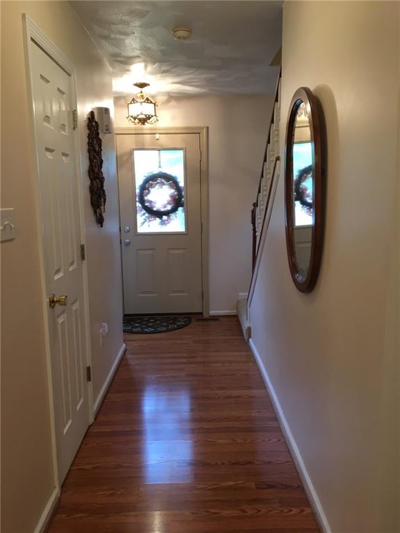 2904 Brodhead Road Aliquippa, PA 15001 - Photo 4 of 20 ENTRY 12x5 Easy to clean laminate leads from the front door to the kitchen. Powder room on the left.