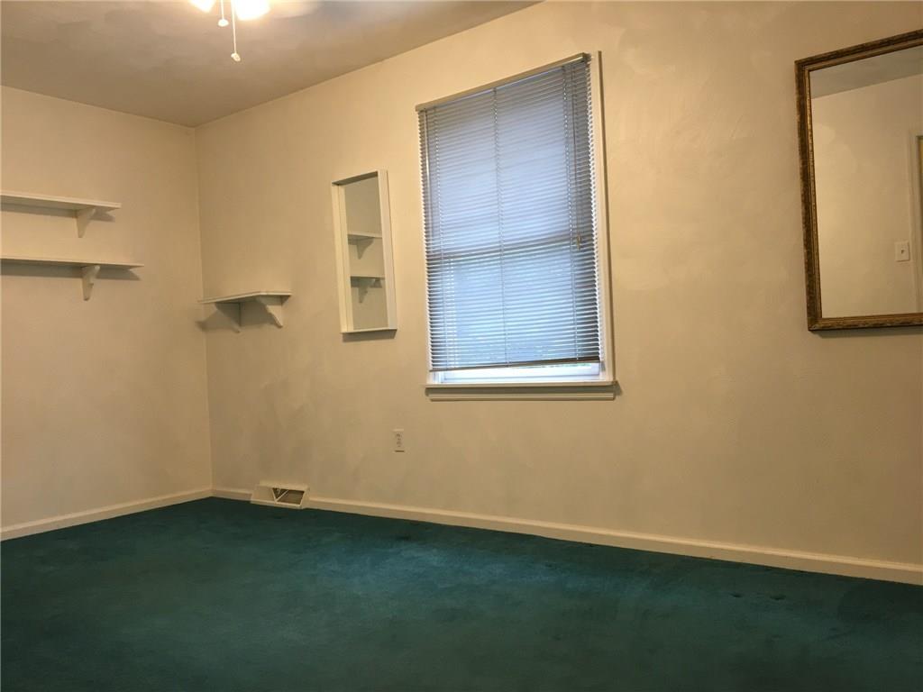2904 Brodhead Road Aliquippa, PA 15001 - Photo 10 of 20 BEDROOM 2 15x9 Spacious second bedroom with included shelving. Generous closet. Carpeted. Neutral tone on walls.