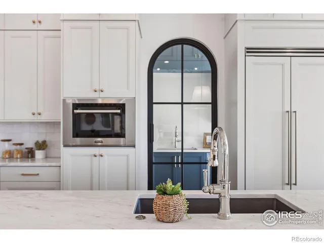 a kitchen with a sink and cabinets