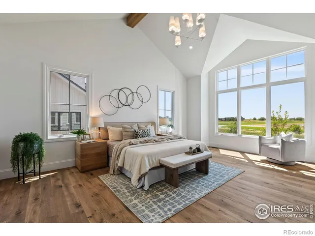 a living room with furniture a dining table and a large window
