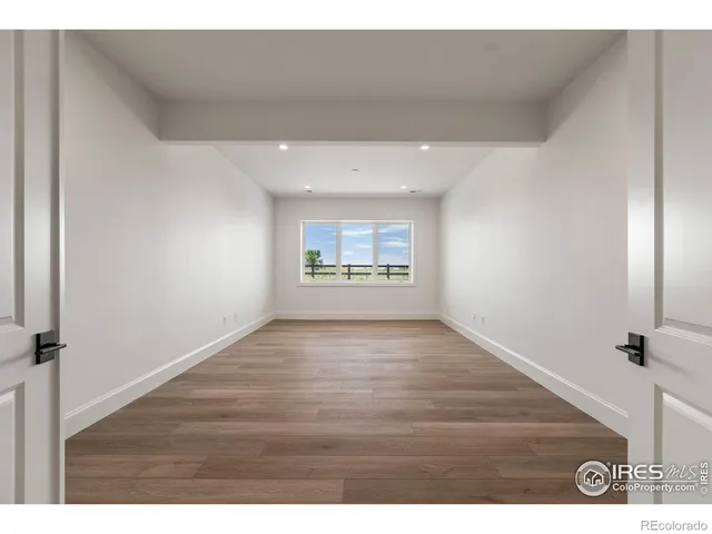 a bathroom with a granite countertop sink a toilet a mirror and shower