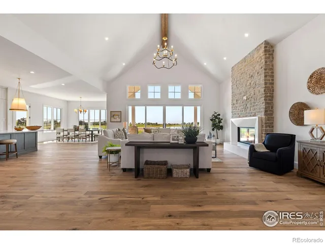 a view of living room with furniture and a wooden floor