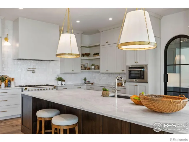 a kitchen with a sink and a stove