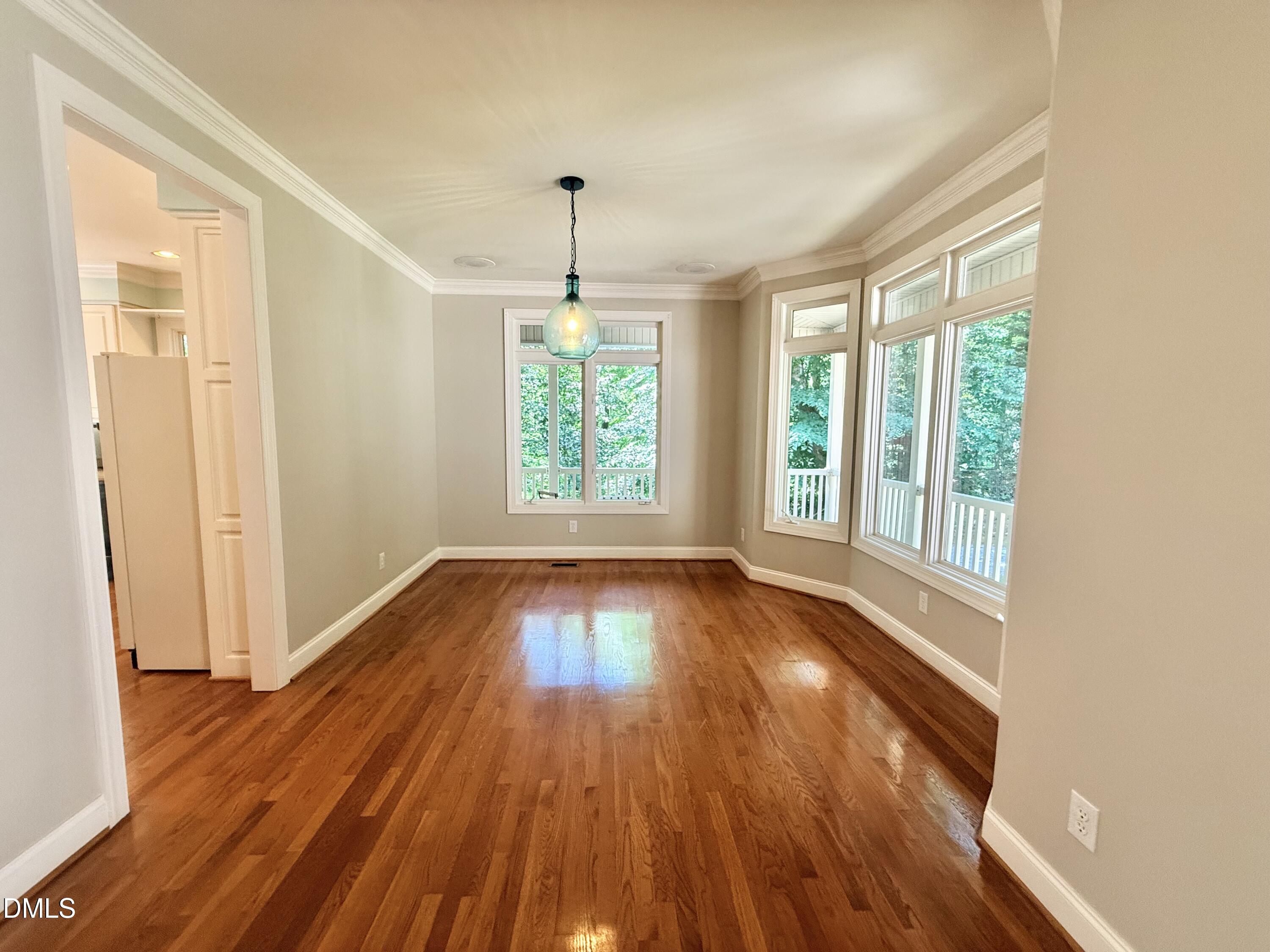 81 Beaver Crossing Road Roxboro, NC 27574 - Photo 18 of 80 a view of an empty room with wooden floor and a window