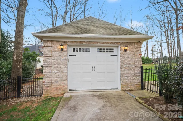a view of a house with wooden fence