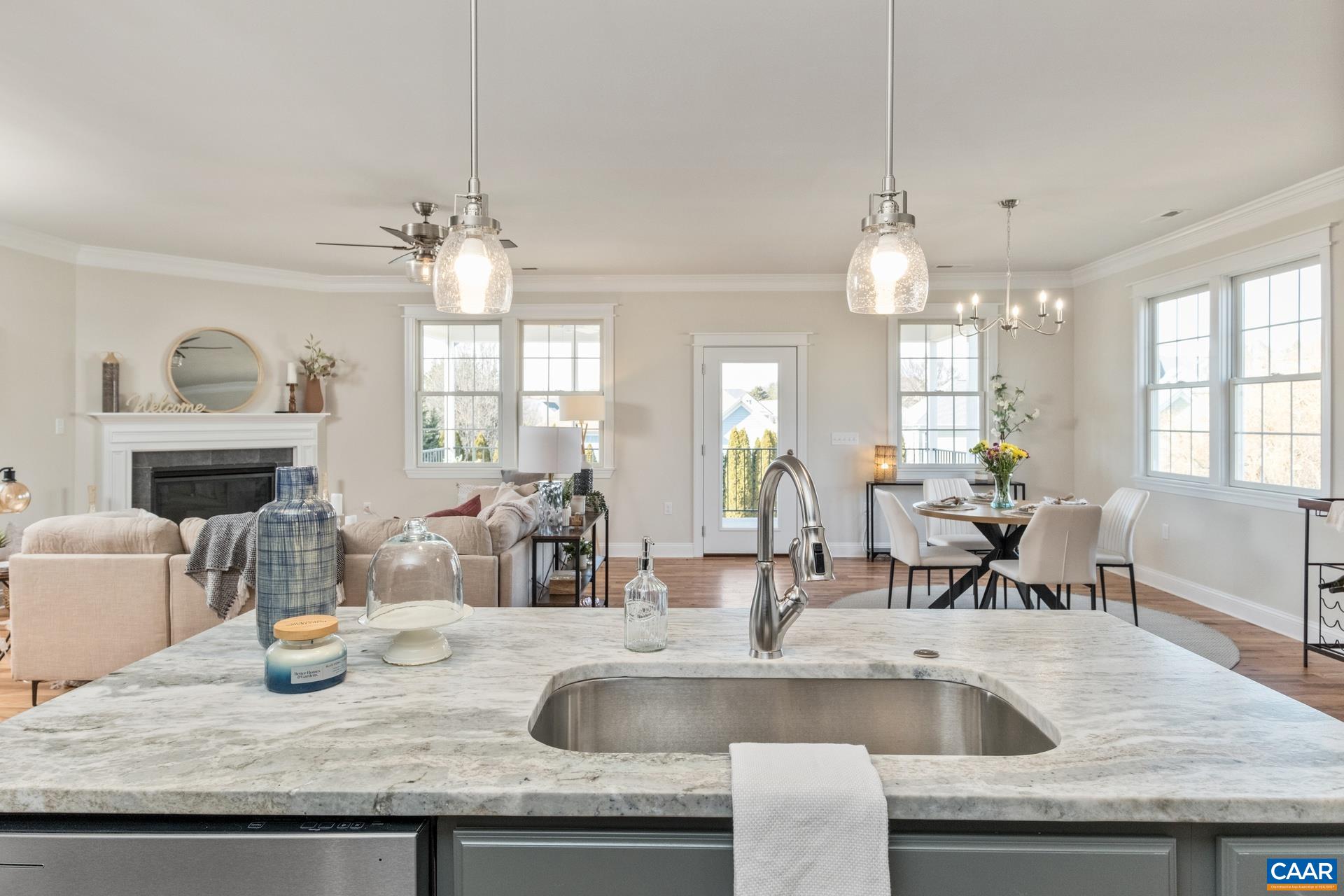 2524 Belvue Road Waynesboro, VA 22980 - Photo 17 of 51 The sink and island workspace area overlooks the brightly lit living room, dining room, and covered porch. This picture is from a similar property that has already been built.