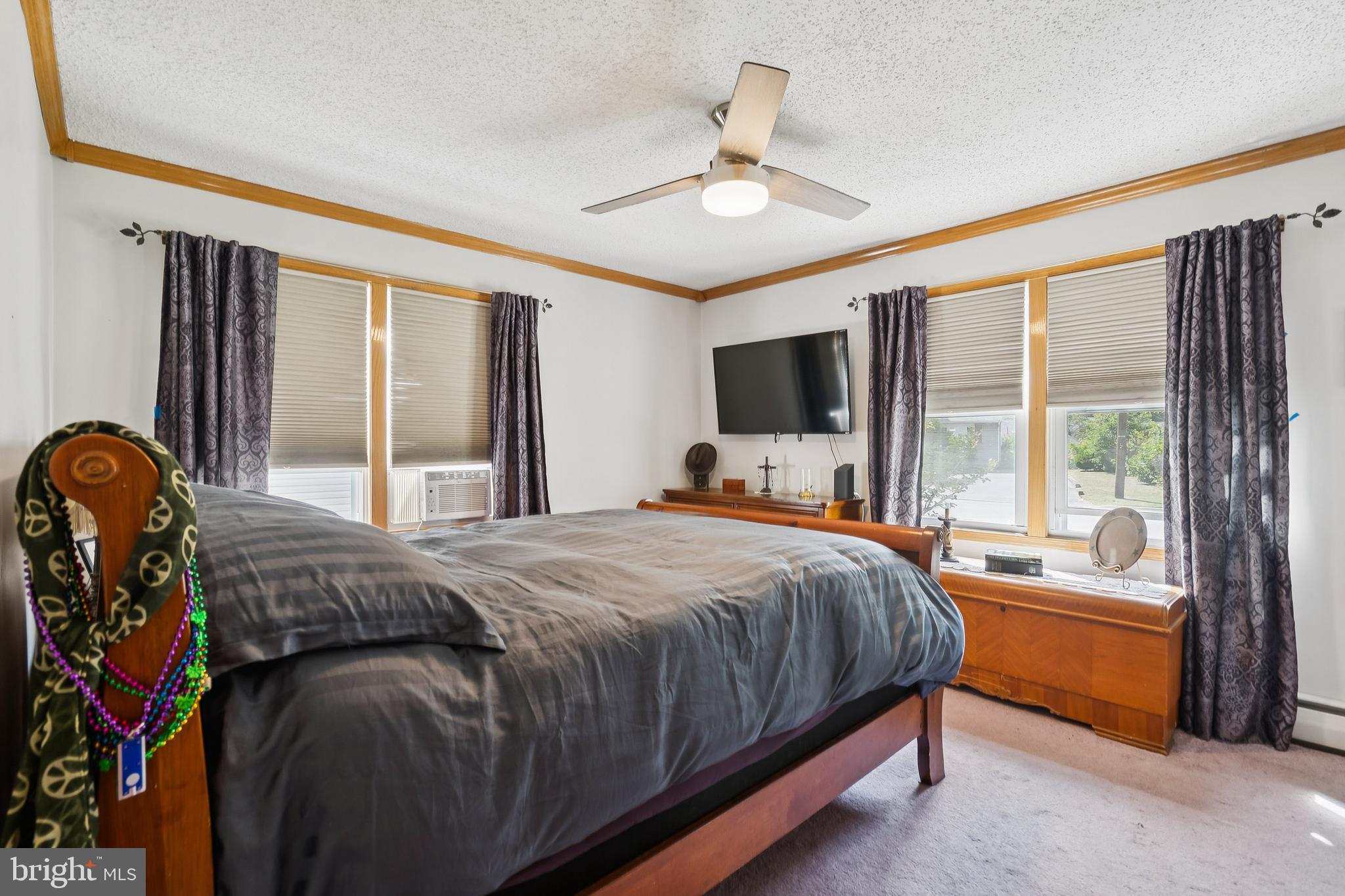 360 Station Road Roebling, NJ 08554 - Photo 13 of 28 a bedroom with a bed flat screen tv and a large window