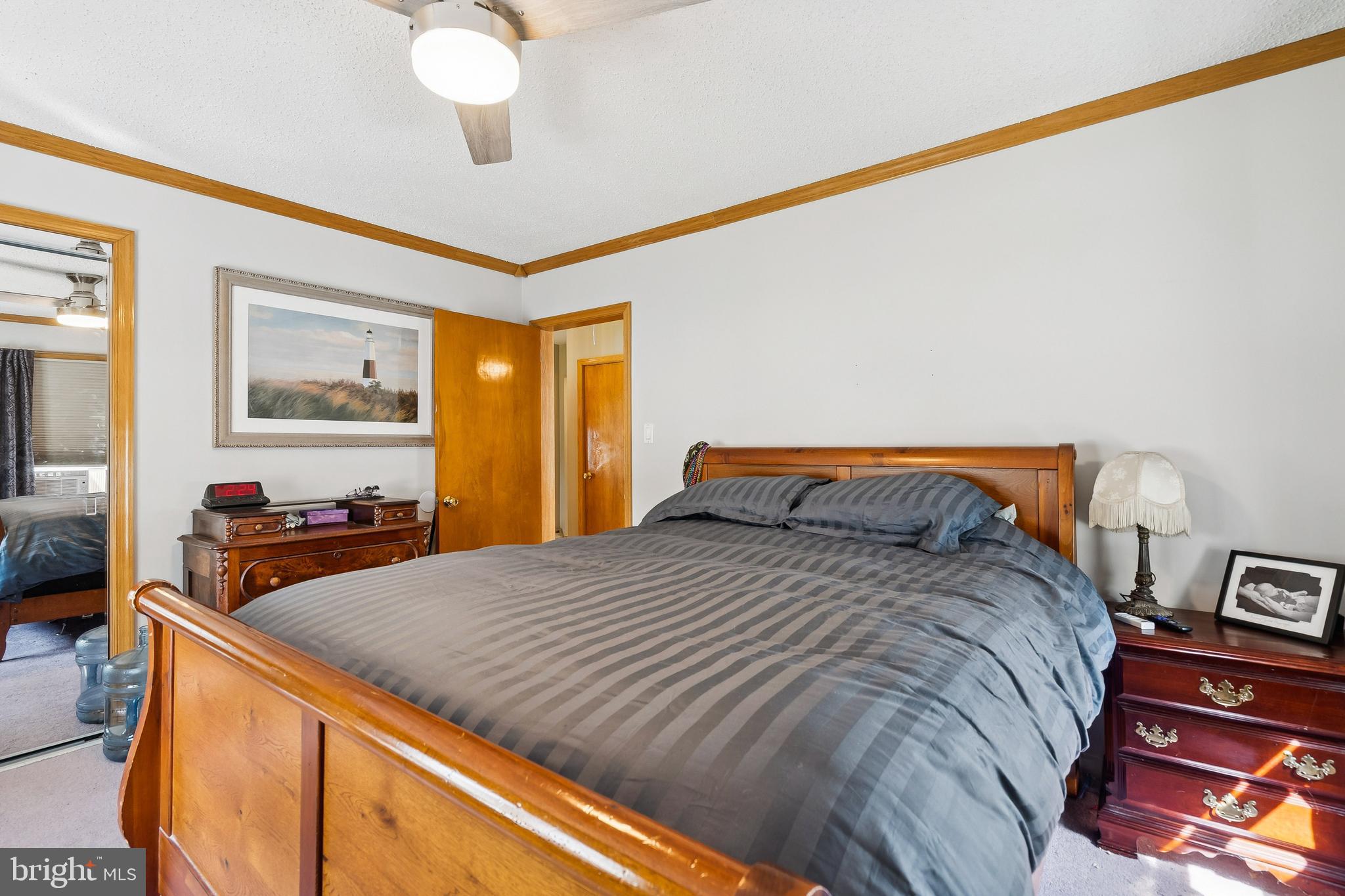 360 Station Road Roebling, NJ 08554 - Photo 14 of 28 a bedroom with a bed and a chandelier