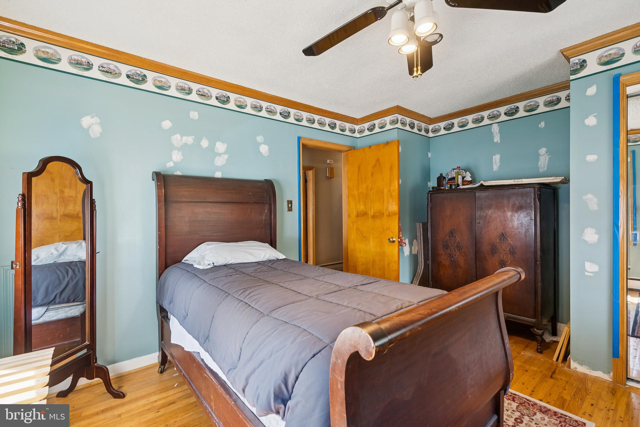 360 Station Road Roebling, NJ 08554 - Photo 16 of 28 a bed room with a bed and a mirror