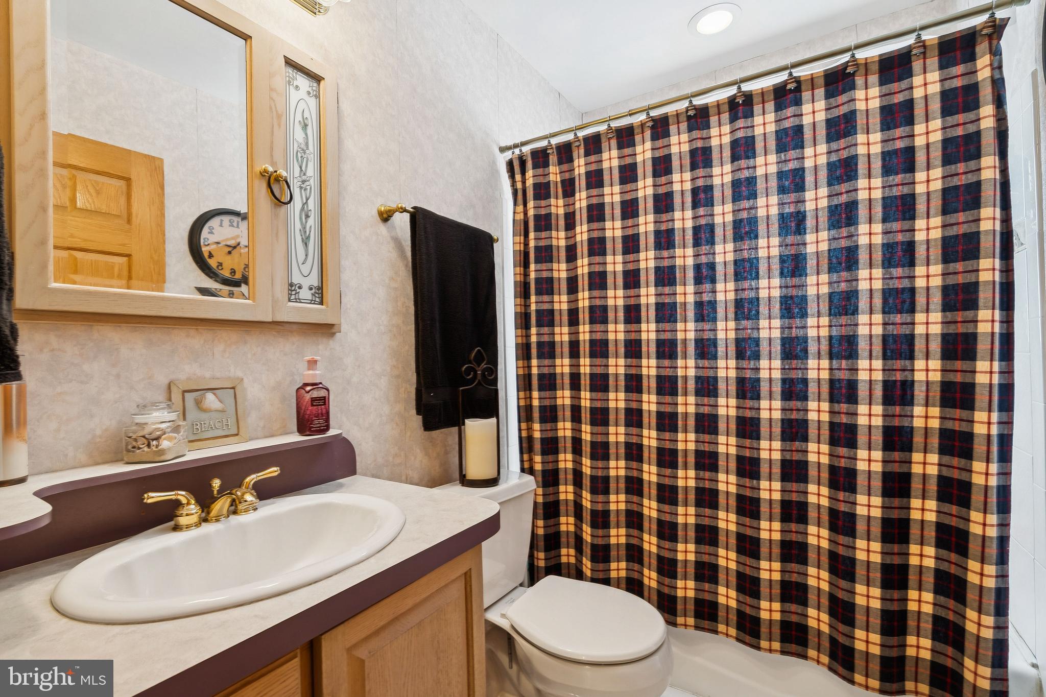 360 Station Road Roebling, NJ 08554 - Photo 17 of 28 a bathroom with a sink a toilet a mirror and shower