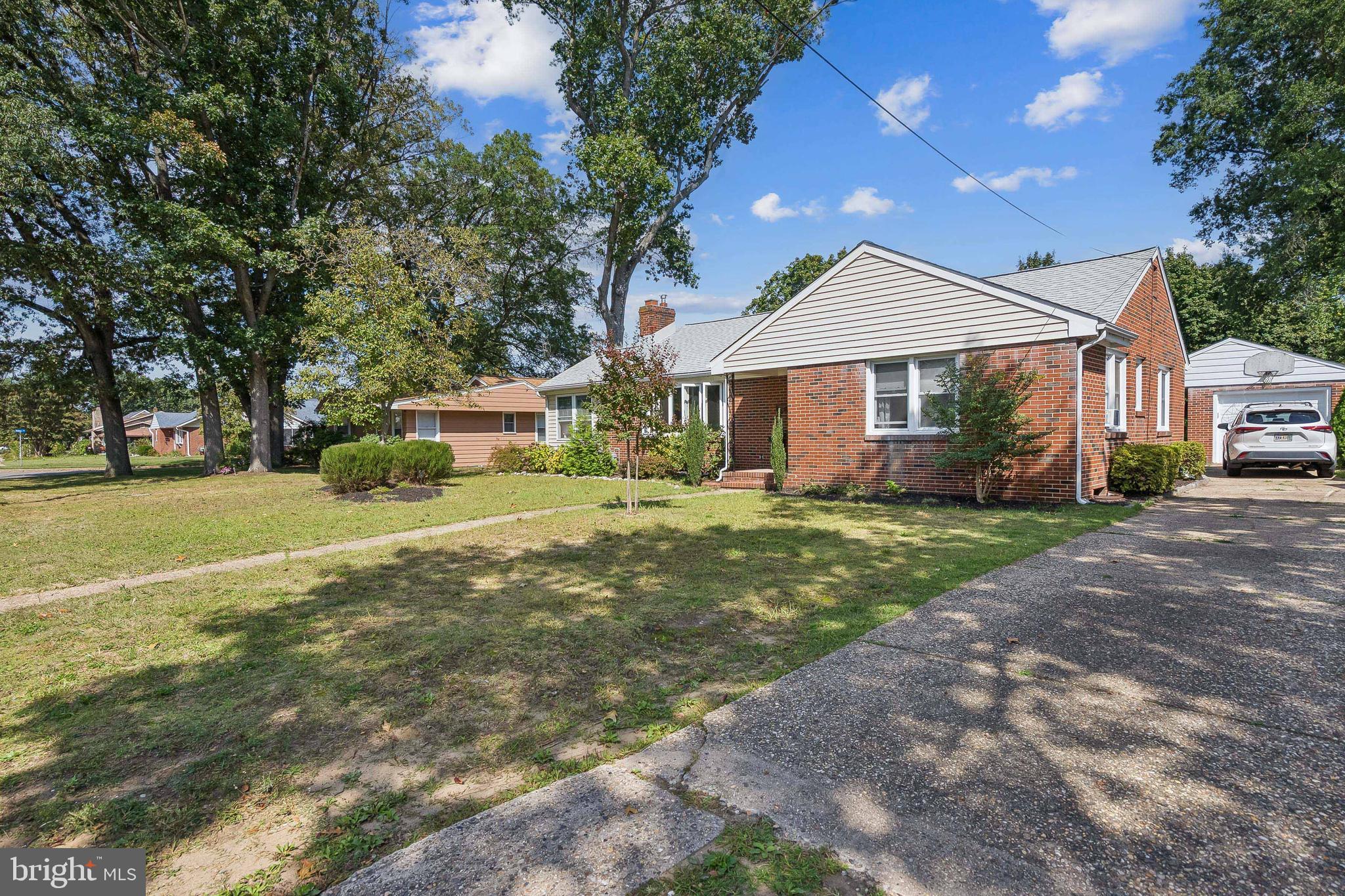 360 Station Road Roebling, NJ 08554 - Photo 2 of 28 a front view of a house with a yard