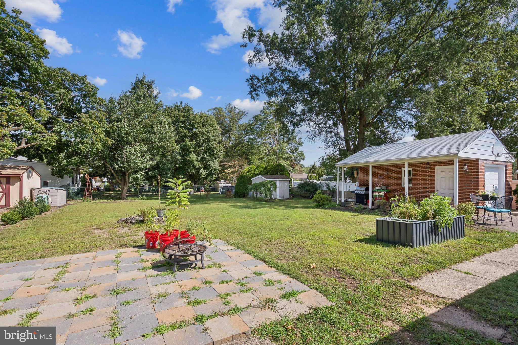 360 Station Road Roebling, NJ 08554 - Photo 23 of 28 a front view of a house with swing and trees
