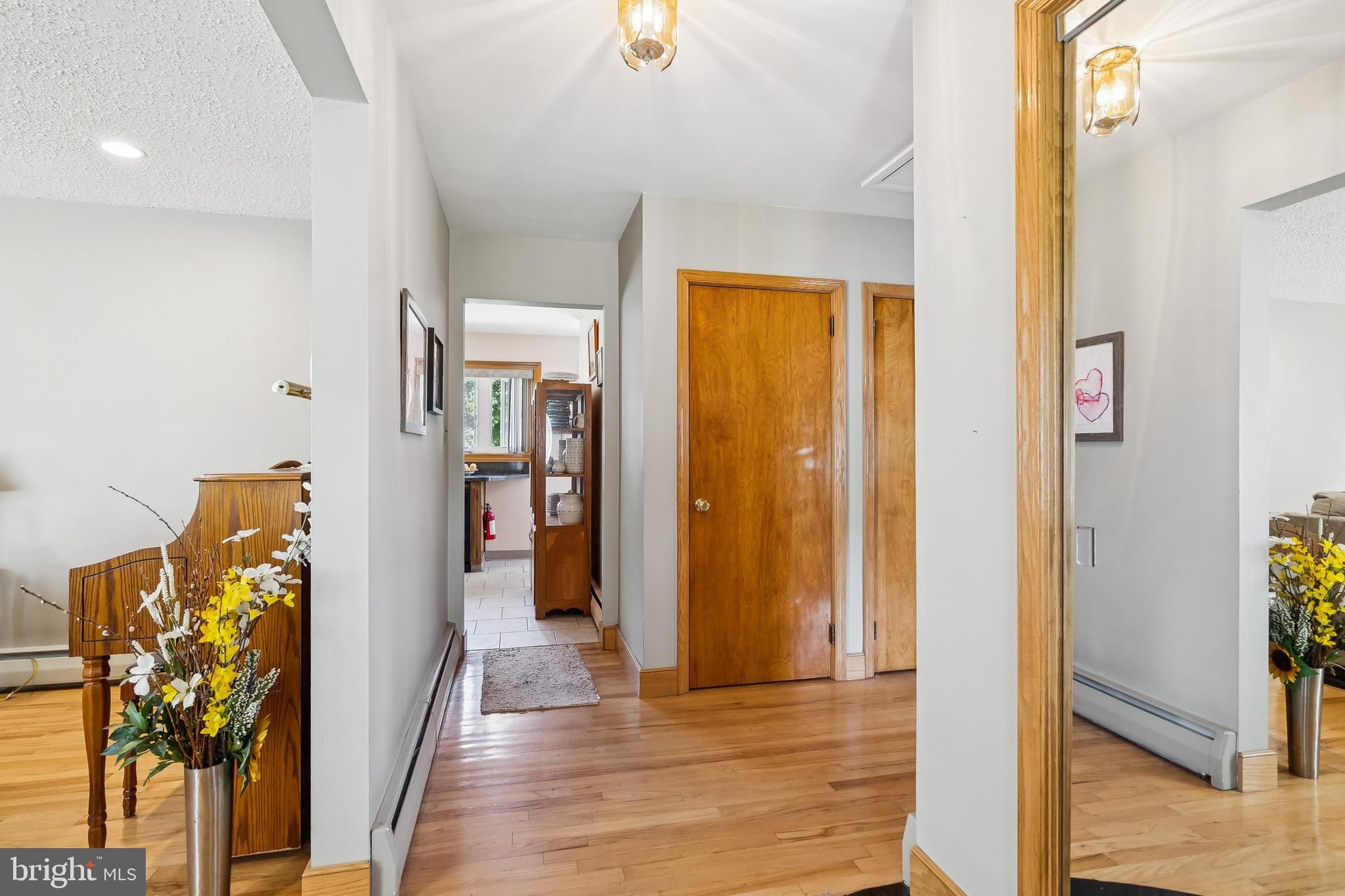 360 Station Road Roebling, NJ 08554 - Photo 3 of 28 a view of a hallway with wooden floor and a living room
