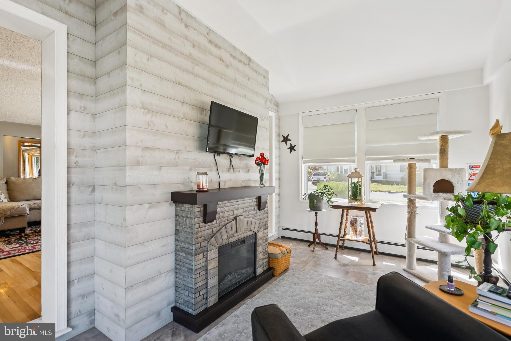 360 Station Road Roebling, NJ 08554 - Photo 7 of 28 a living room with fireplace furniture and a flat screen tv
