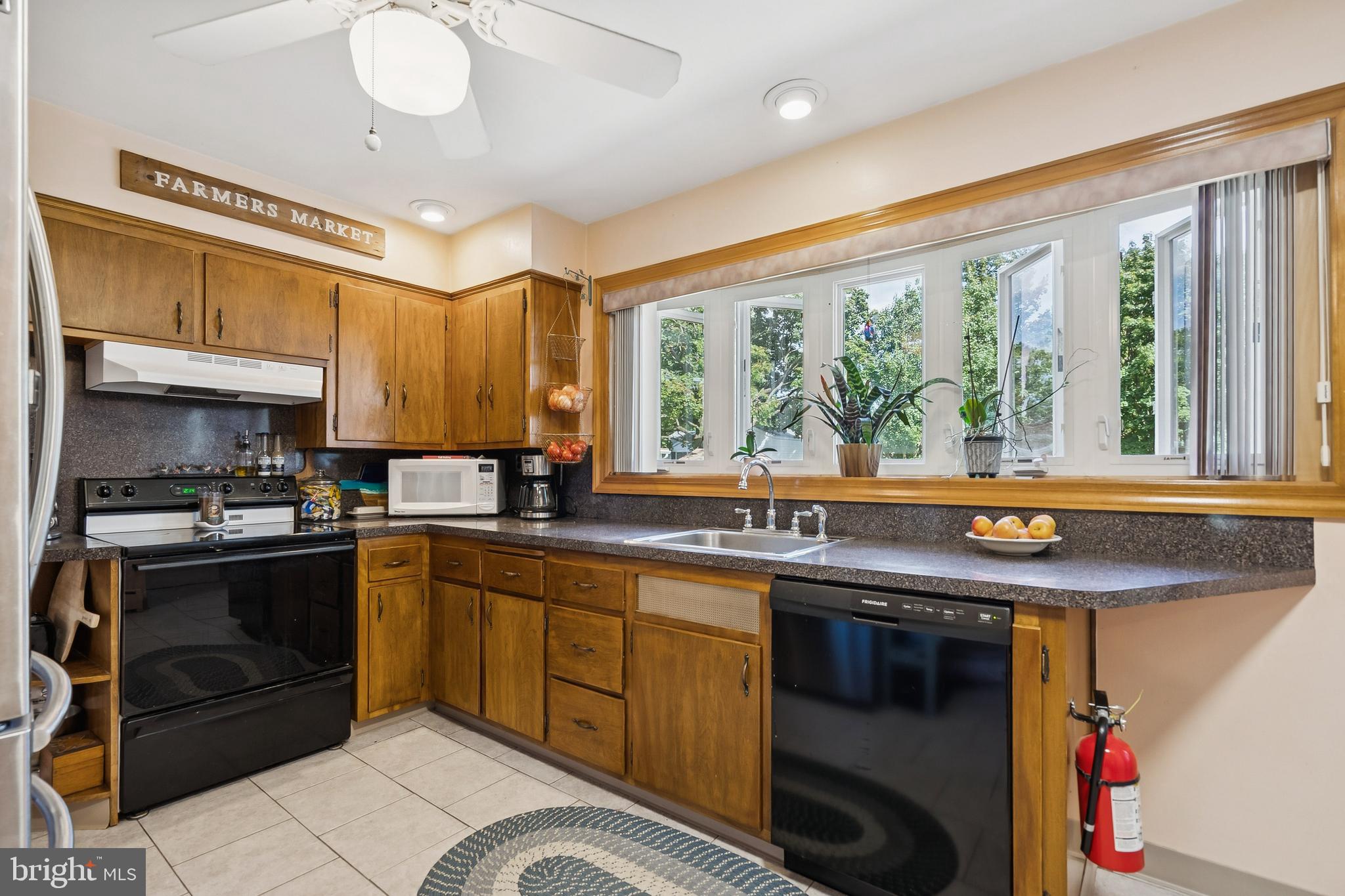 360 Station Road Roebling, NJ 08554 - Photo 9 of 28 a kitchen with a sink stove and cabinets
