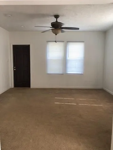 a view of an empty room and window