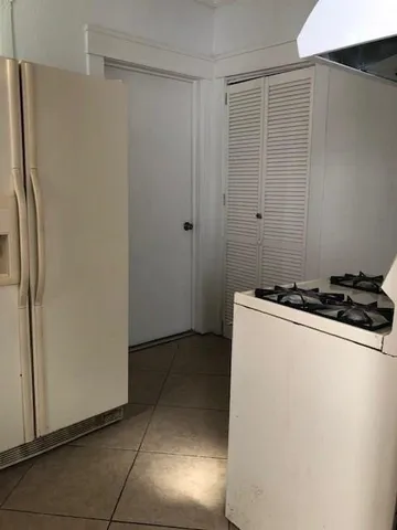 a view of a refrigerator in kitchen